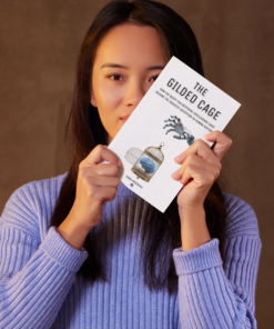 A chinese AI researcher who works at OpenAI holding the book The Gilded Cage - How the Quest for Artificial Intelligent (AGI) Became the Greatest Deception in Human History.